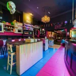 Main Bar Area Are You Mad Neon Sign Chandelier Colourful Decor — The Mad House Dean Street, Newcastle