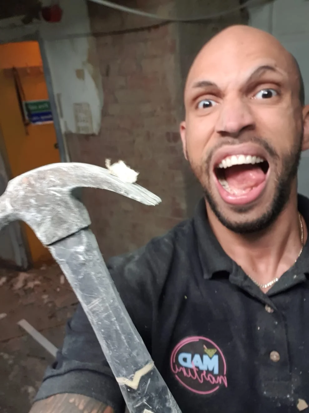 The Mad House Newcastle founder doing demolition during hands-on build